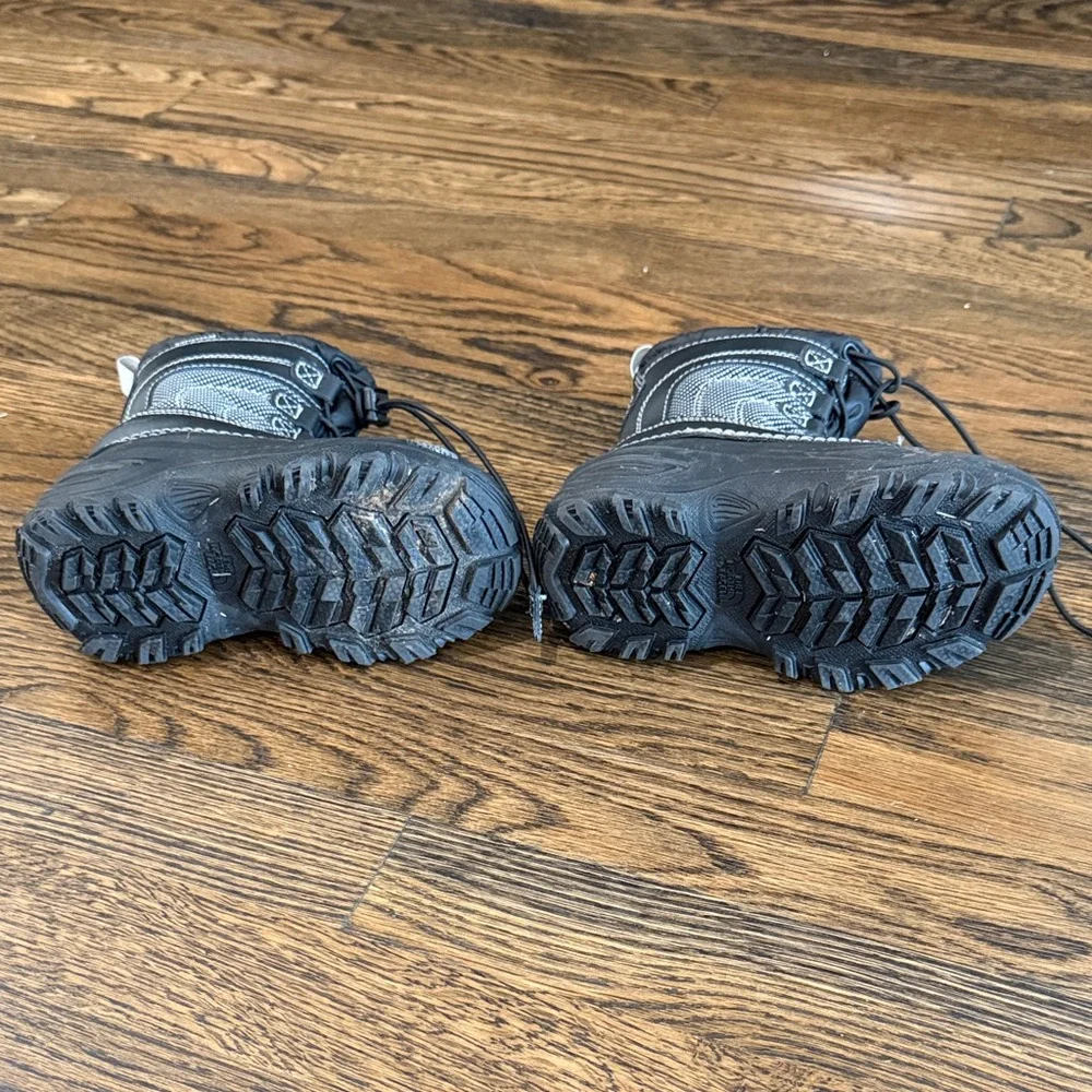 The North Face Kids Black Snow Boots with Red Lining